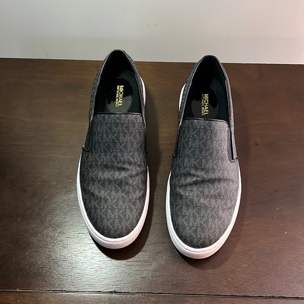 Black Michael Kors size 11 slip on sneakers. Rarely worn.